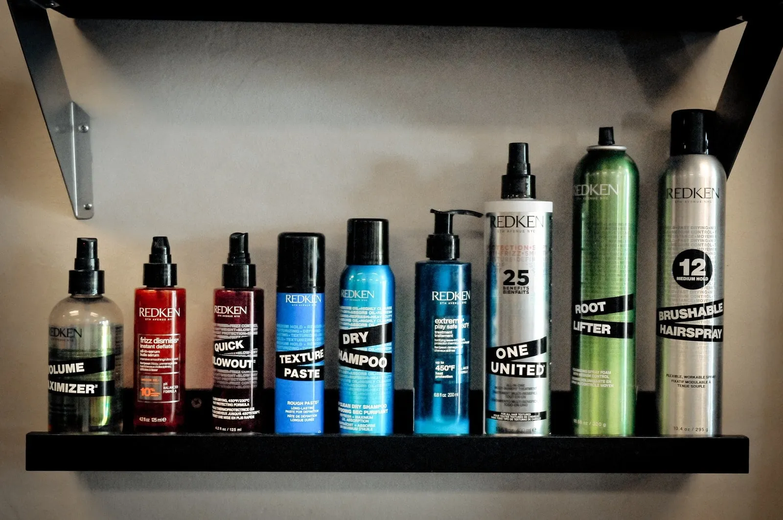 Shelf of Redken professional haircare products at D & S Styling in Folsom, CA